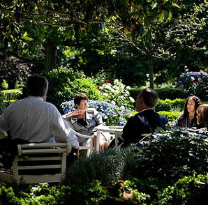 people meeting in a garden